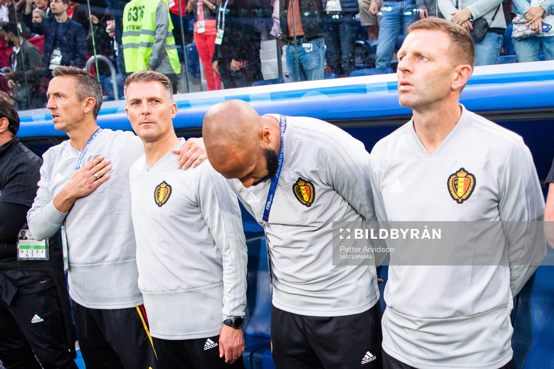 Assisting coach Thierry Henry (bows) of Belgium prior to