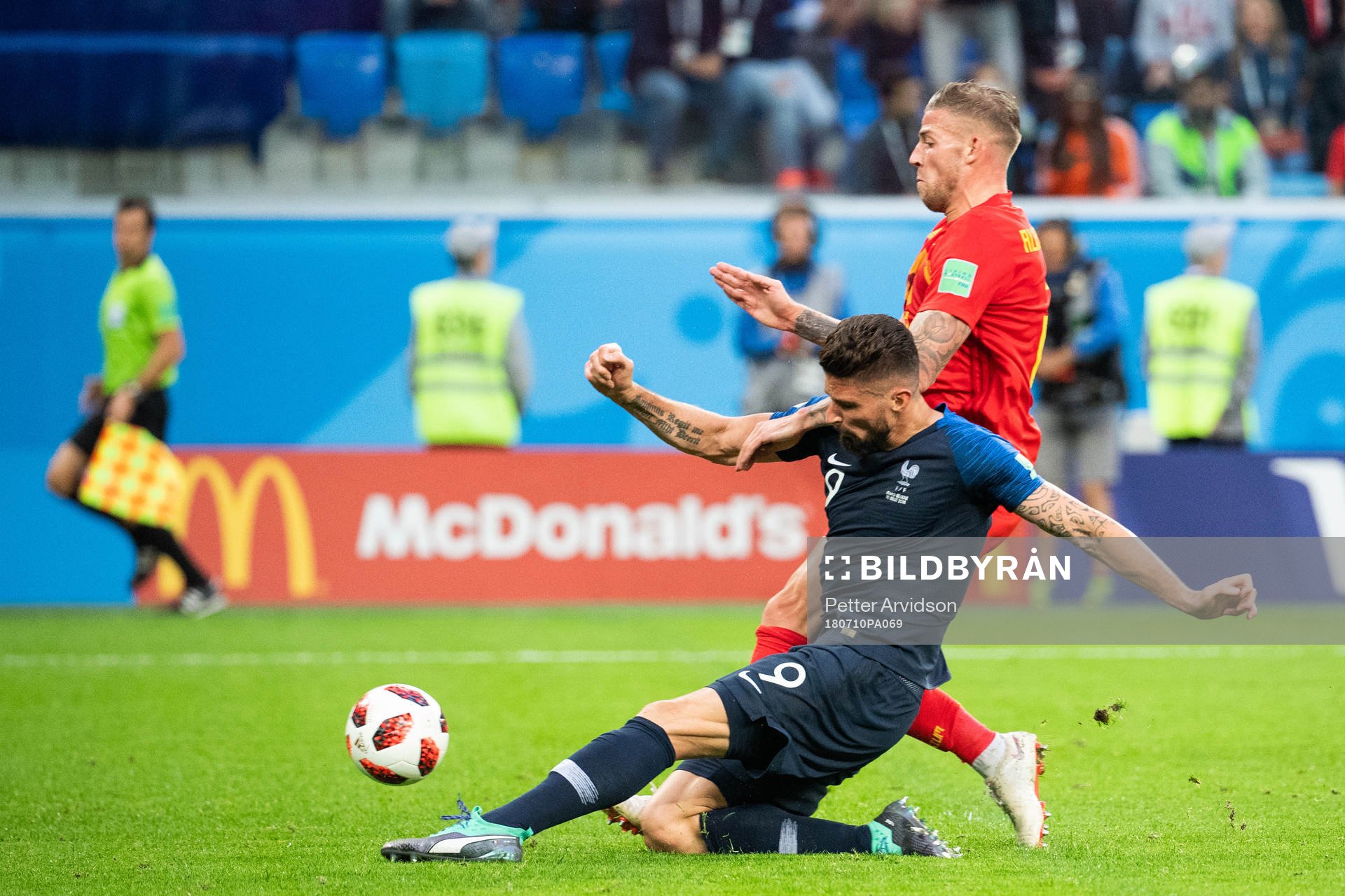 Olivier Giroud of France competes for the ball with Toby