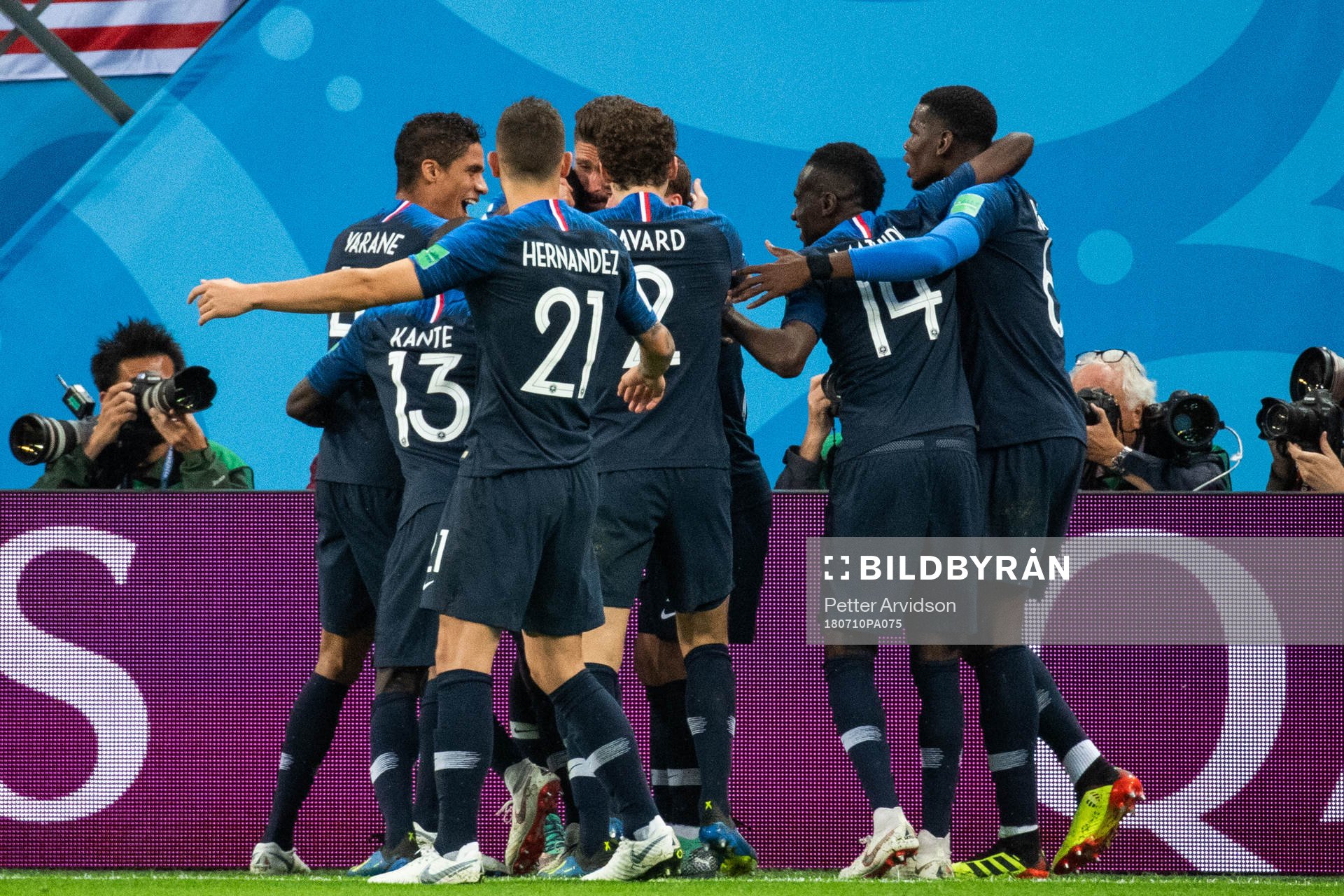 Samuel Umtiti celebrates swith team mates Raphael Varane