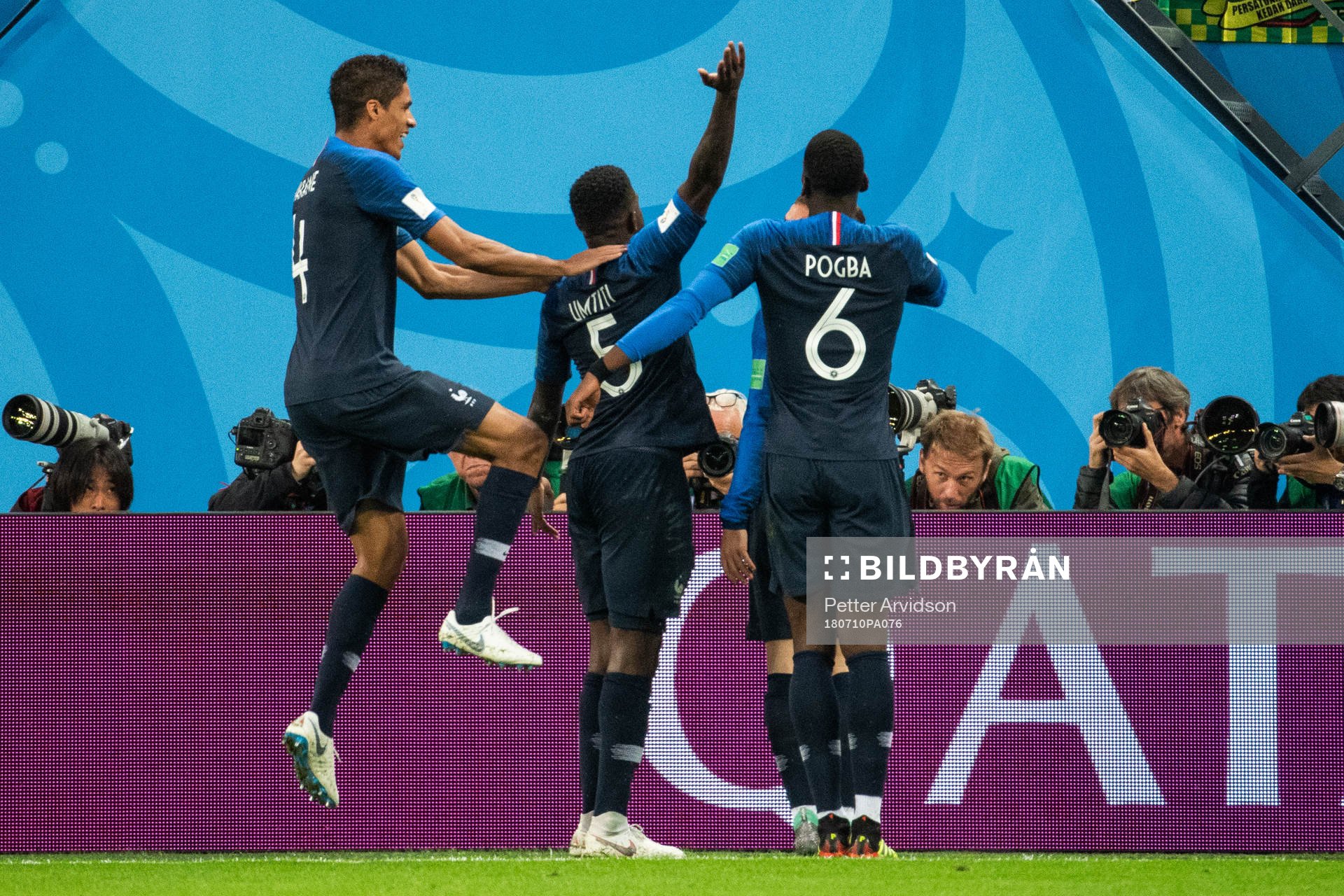 Samuel Umtiti celebrates swith team mates Raphael Varane