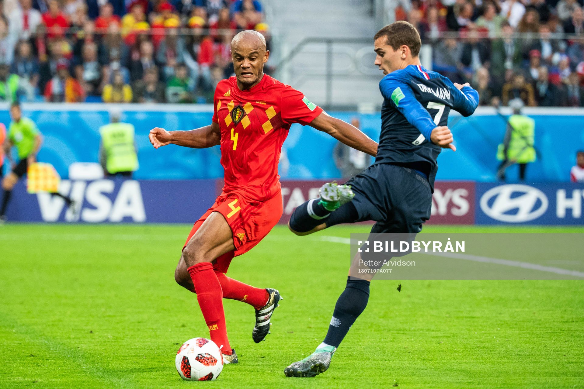 Vincent Kompany of Belgium and Antoine Griezmann of France