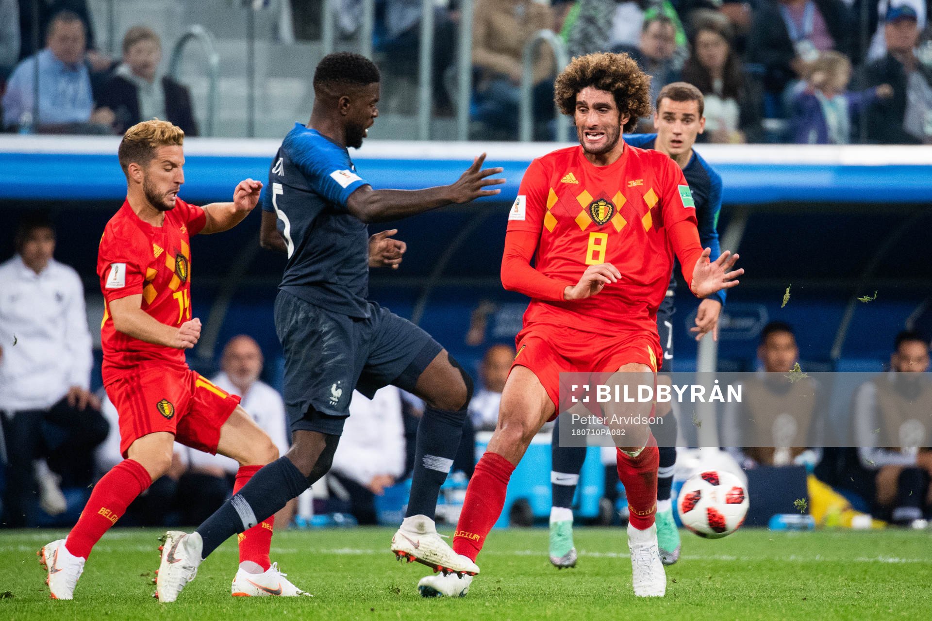 Samuel Umtiti of France and Marouane Fellaini of Belgium
