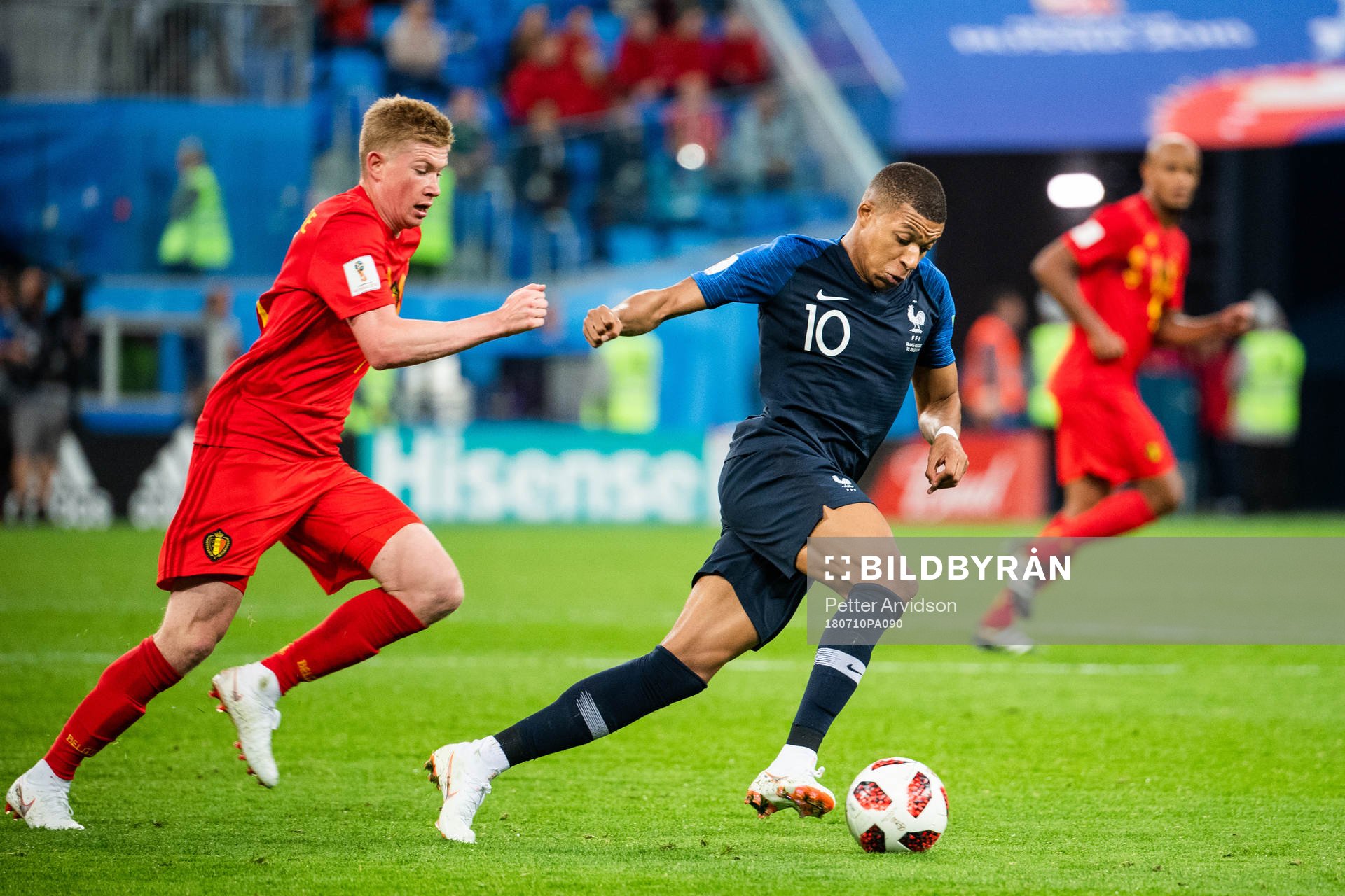 Kevin De Bruyne of Belgium chases Kylian Mbappe of France