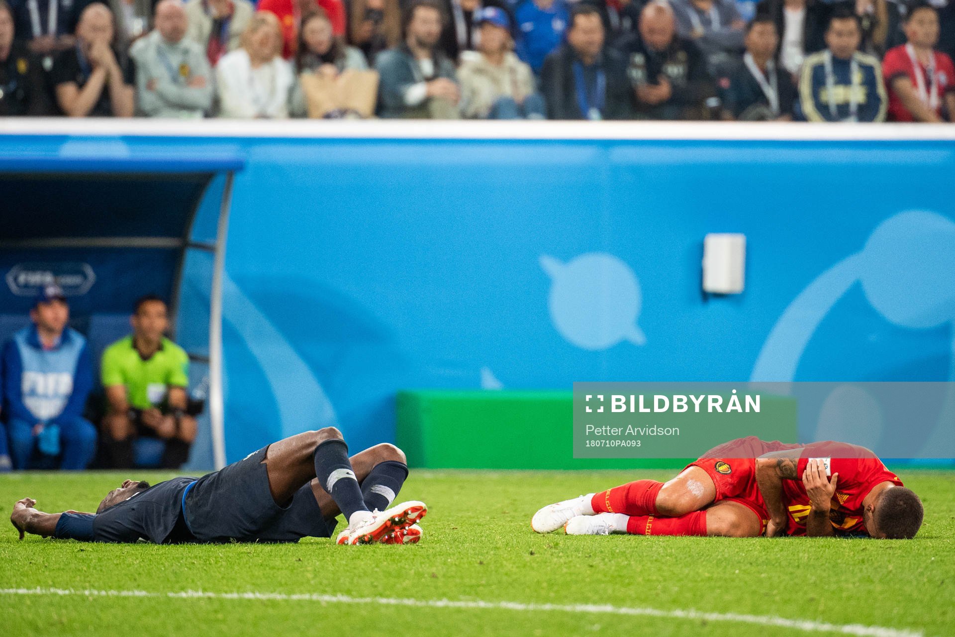 Blaise Matuidi of France and Eden Hazard of Belgium lies