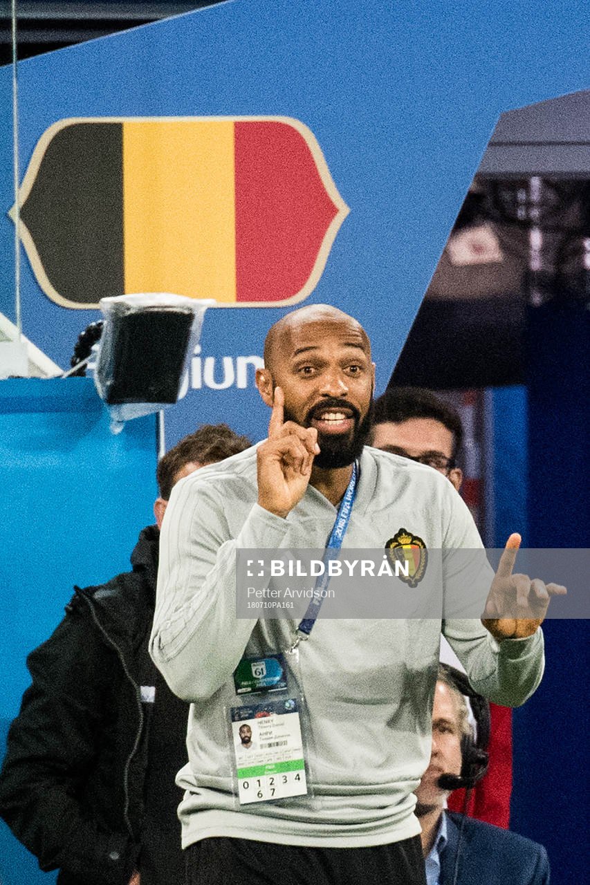 Assisting coach Thierry Henry of Belgium