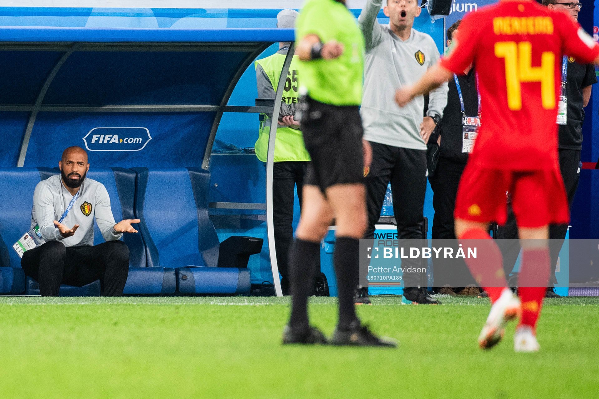 Assisting coach Thierry Henry of Belgium reacts