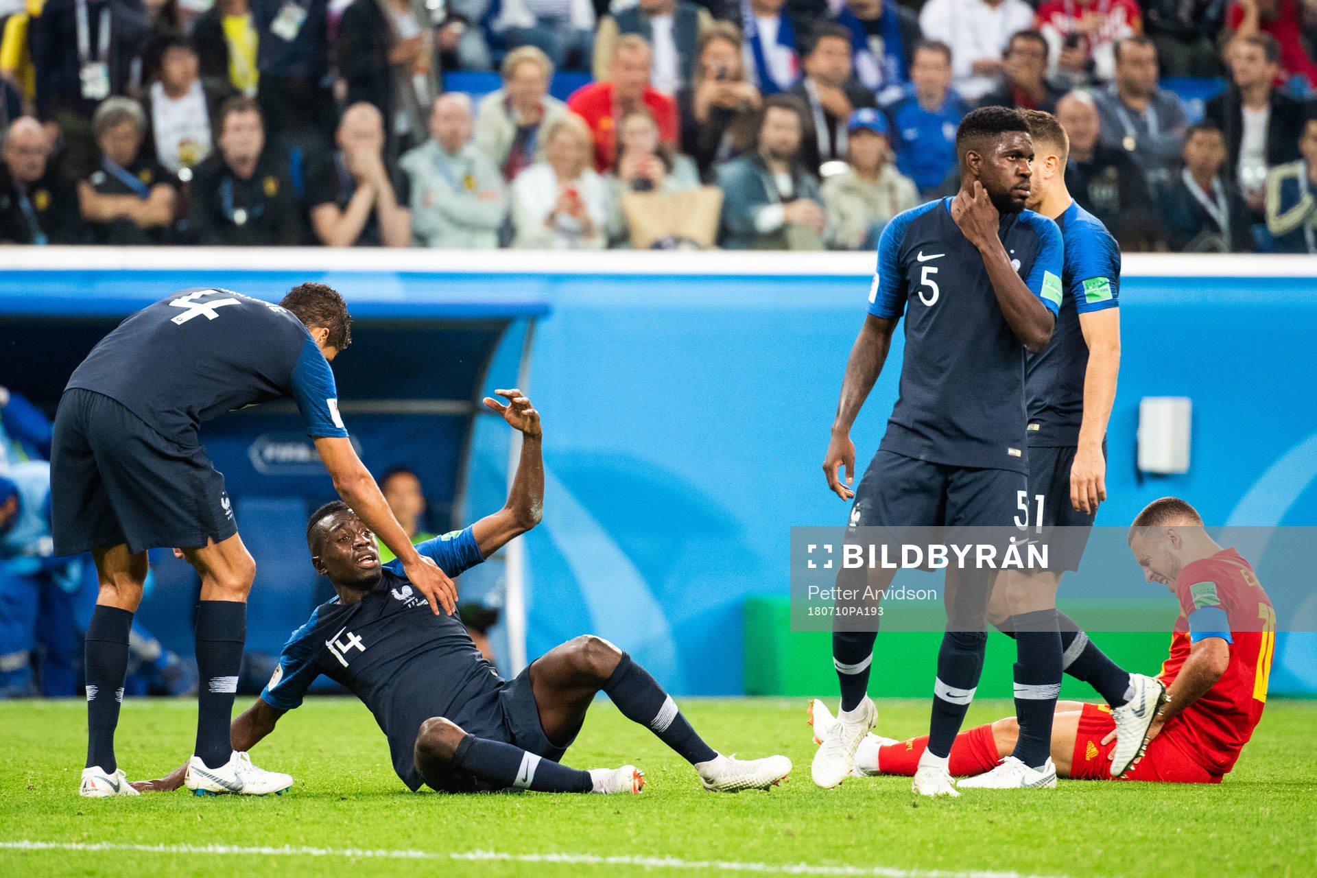 Blaise Matuidi of France and Eden Hazard of Belgium lies