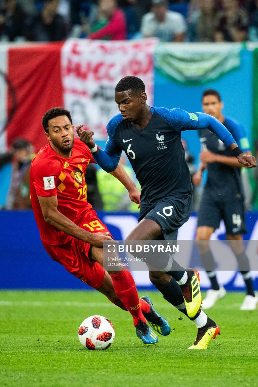 Paul Pogba of France and Moussa Dembele of Belgium