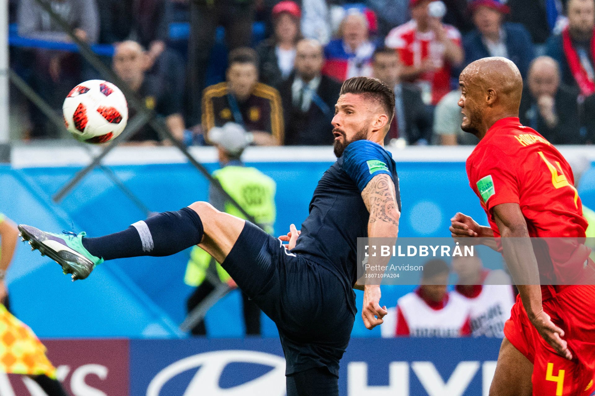 Olivier Giroud of France and Vincent Kompany of Belgium