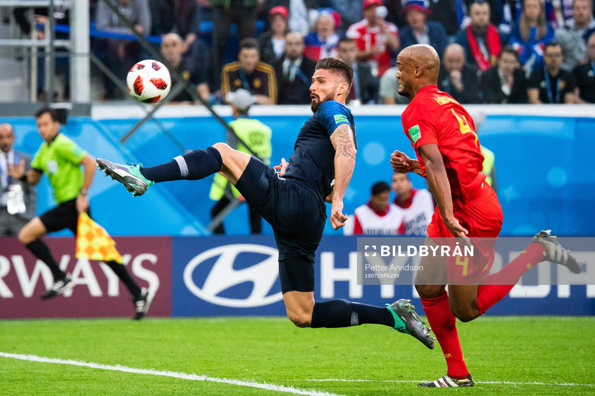 Olivier Giroud of France and Vincent Kompany of Belgium