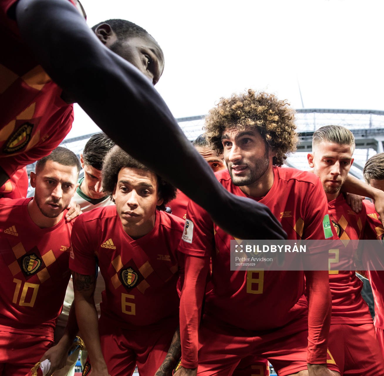 Romelu Lukaku talks to team mates Eden Hazard, Axel Witsel