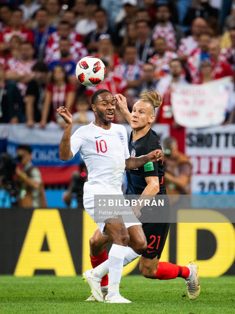 Raheem Sterling of England and Domagoj Vida of Croatia