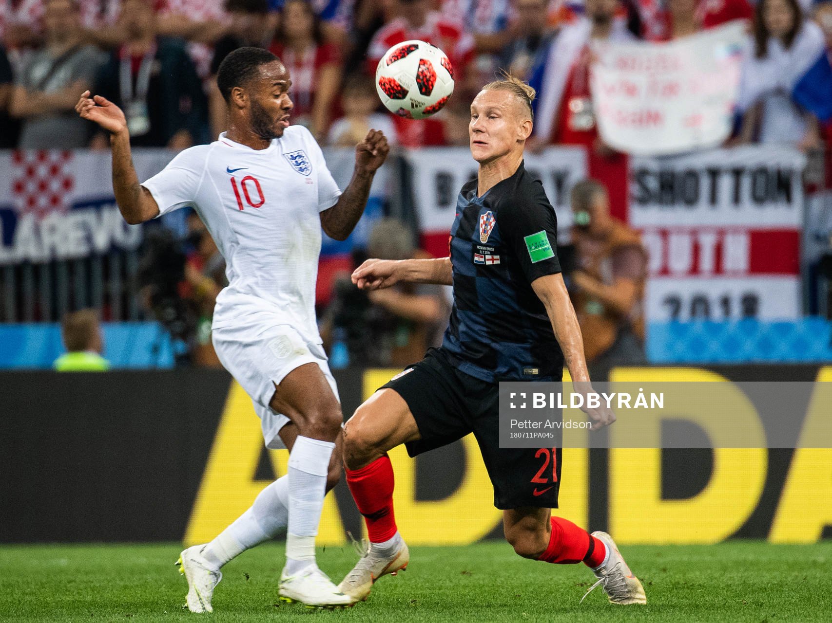 Raheem Sterling of England and Domagoj Vida of Croatia
