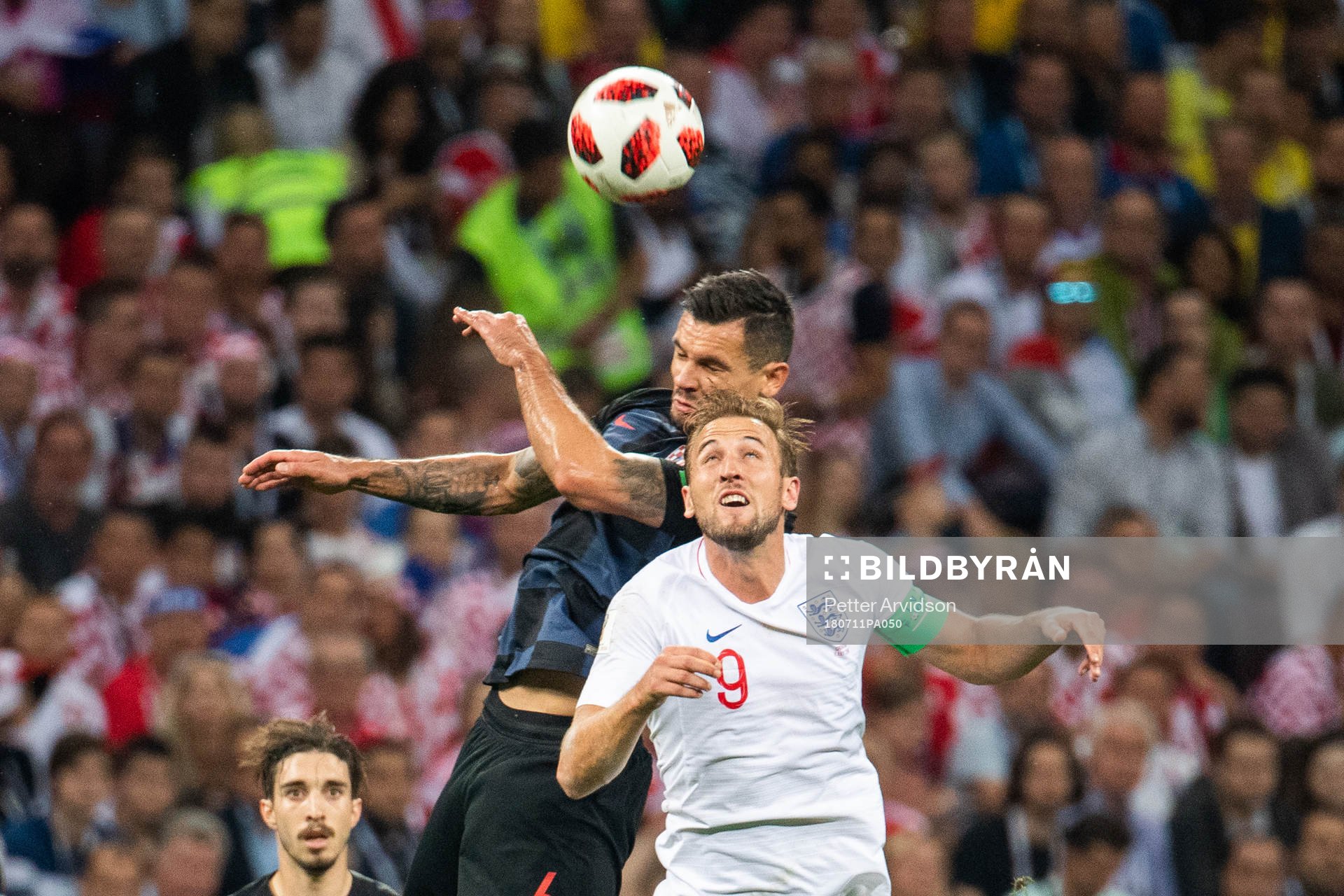 Dejan Lovren of Croatia and Harry Kane of England competes