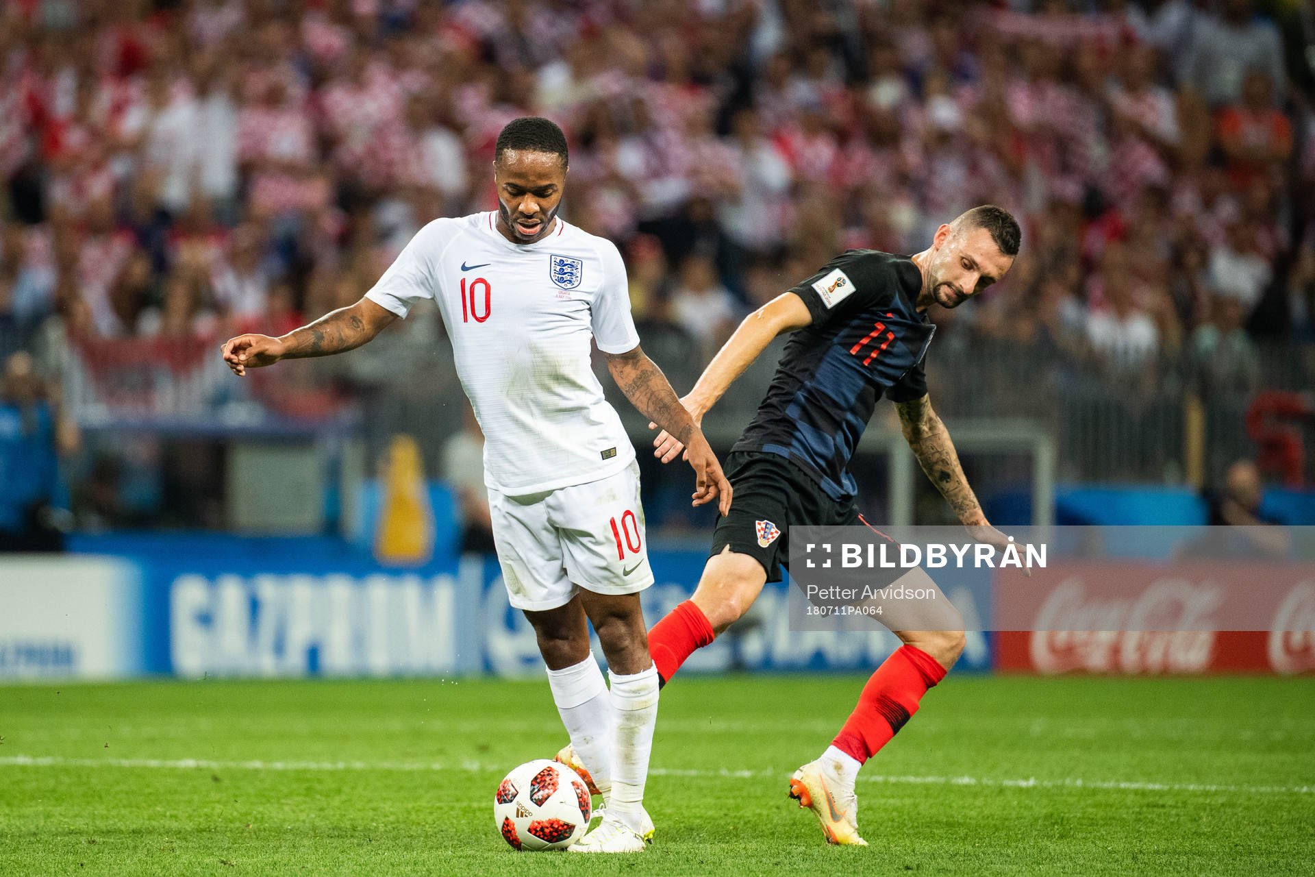 Raheem Sterling of England and Marcelo Brozovic of Croatia