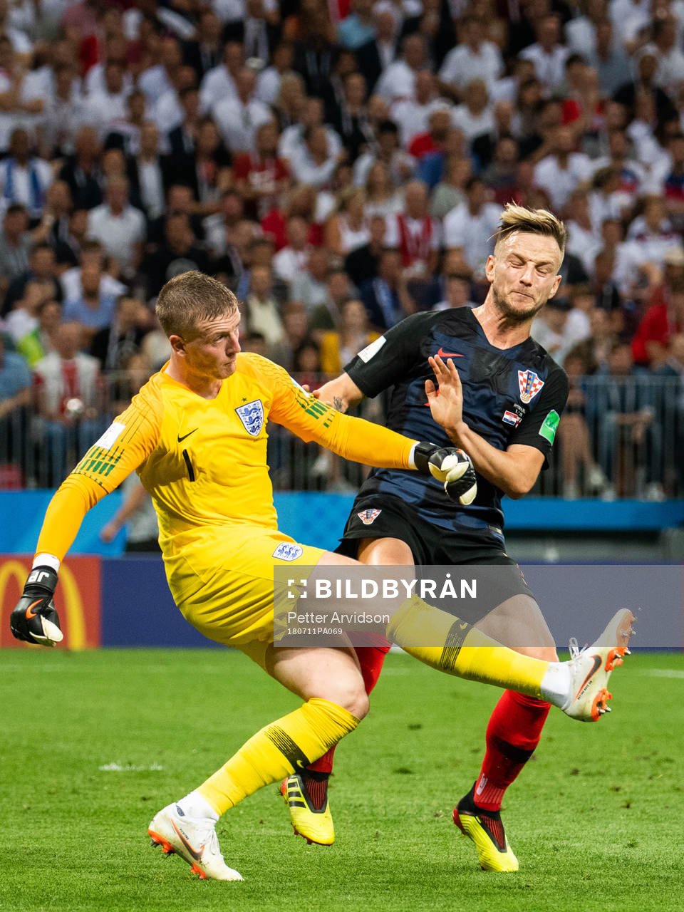 goalkeeper Jordan Pickford of England and Ivan Rakitic of