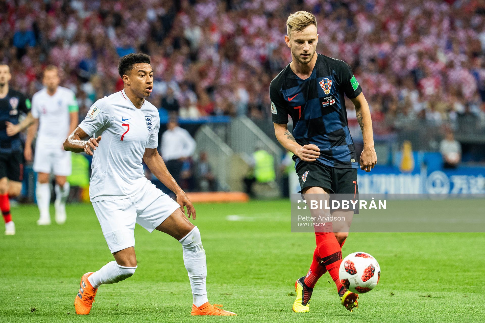 Jesse Lingard of England and Ivan Rakitic of Croatia