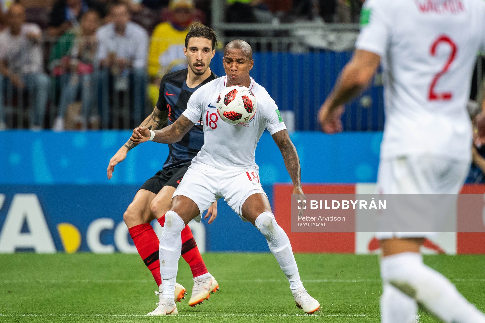 Ashley Young of England competes for the ball with Sime Vrsaljko of Croatia during the FIFA World Cup semi final match between Croatia and England on July 11, 2018 in Moscow.