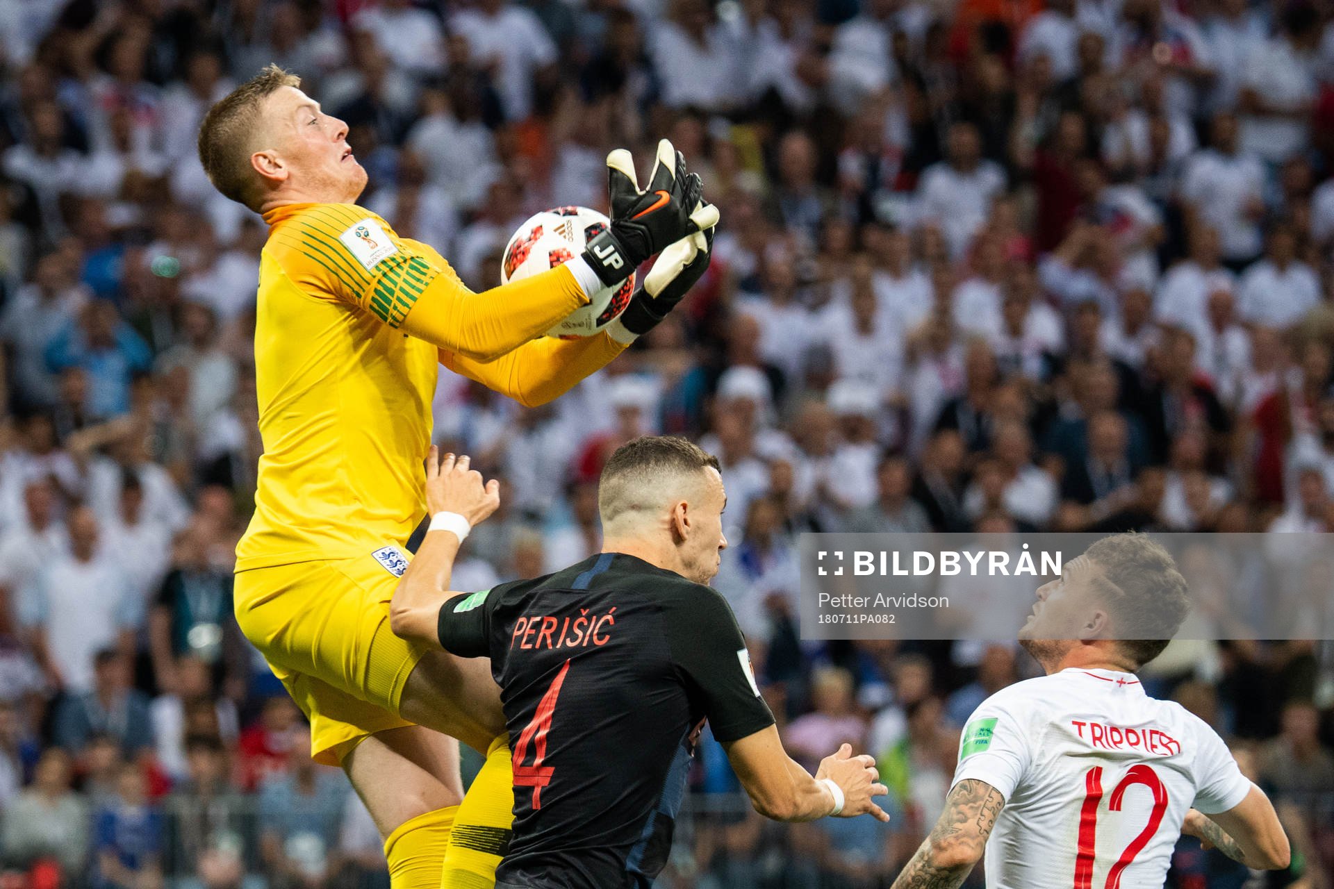 goalkeeper Jordan Pickford of England competes for the ball