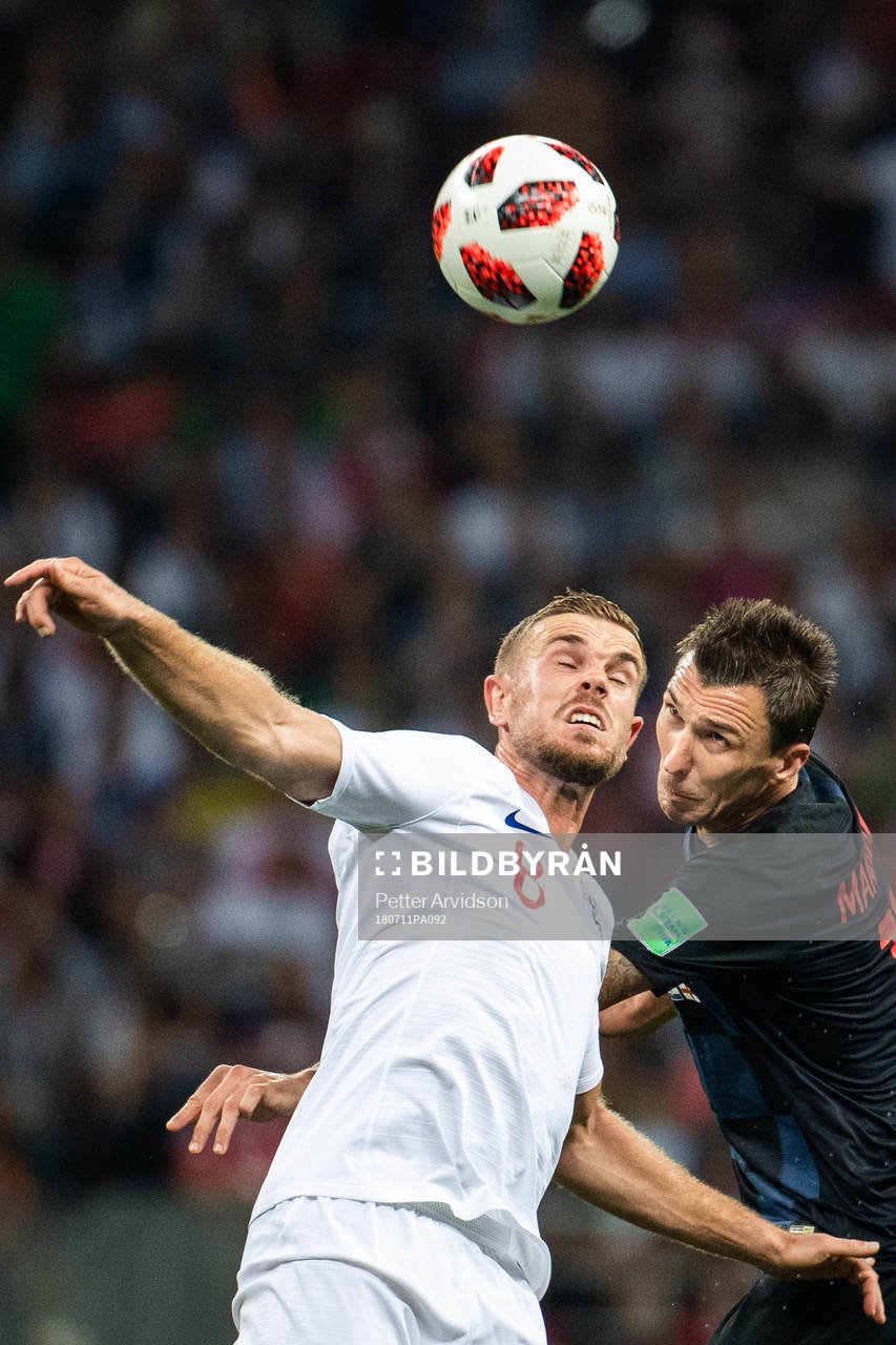 Jordan Henderson of England and Mario Mandzukic of Croatia