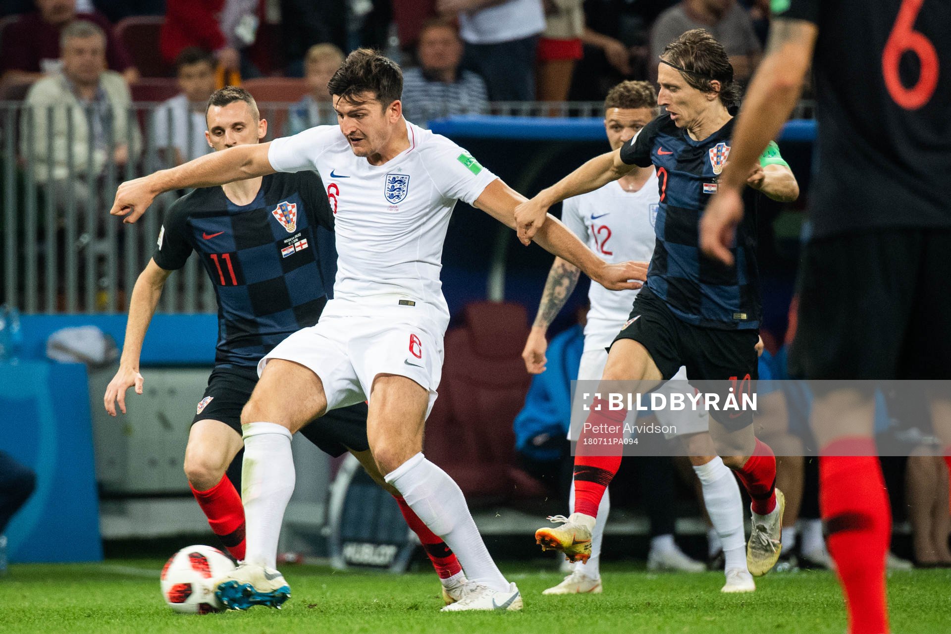 Harry Maguire of England and Marcelo Brozovic of Croatia