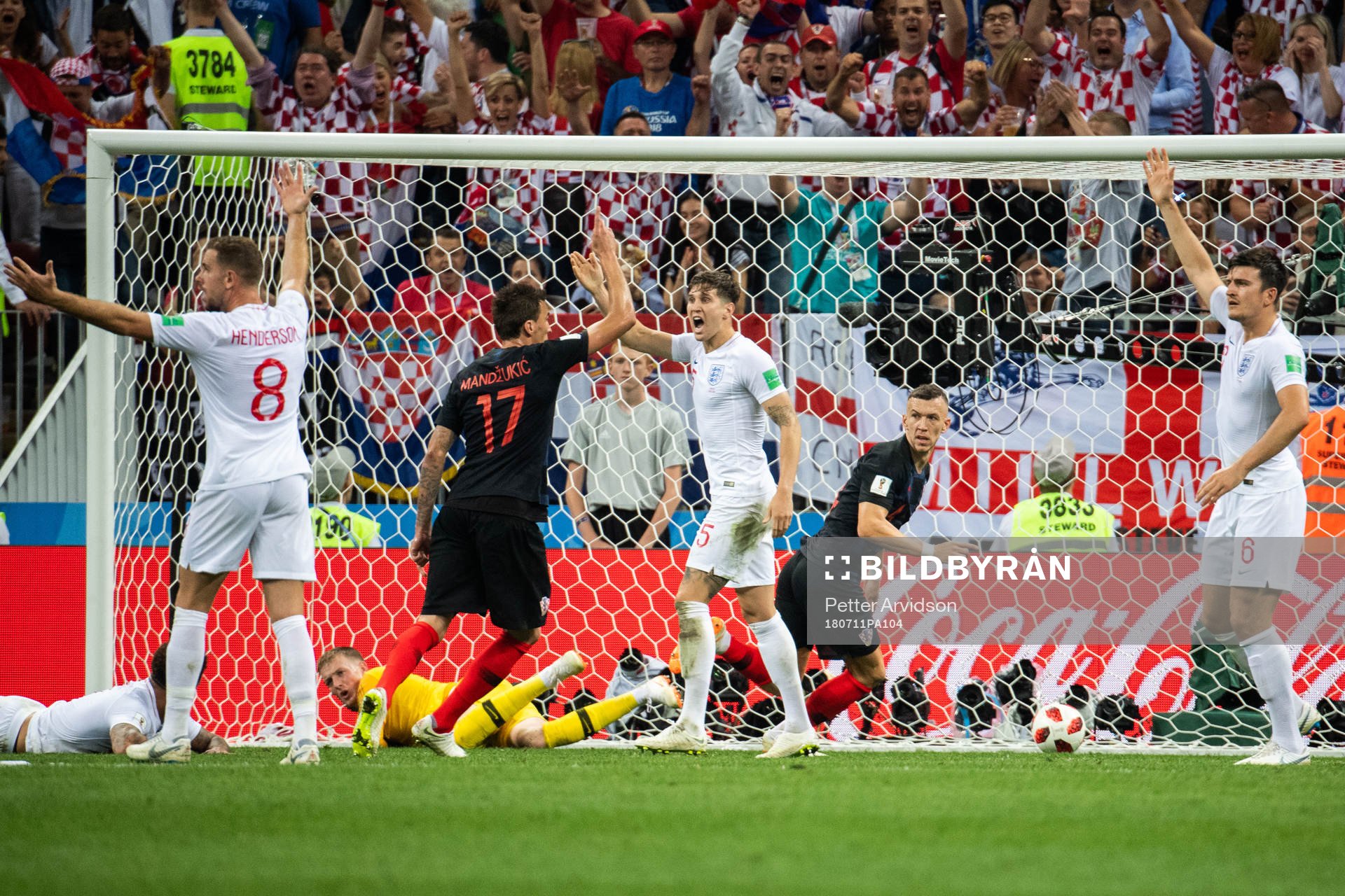 Jordan Henderson, John Stones and Harry Maguire react as