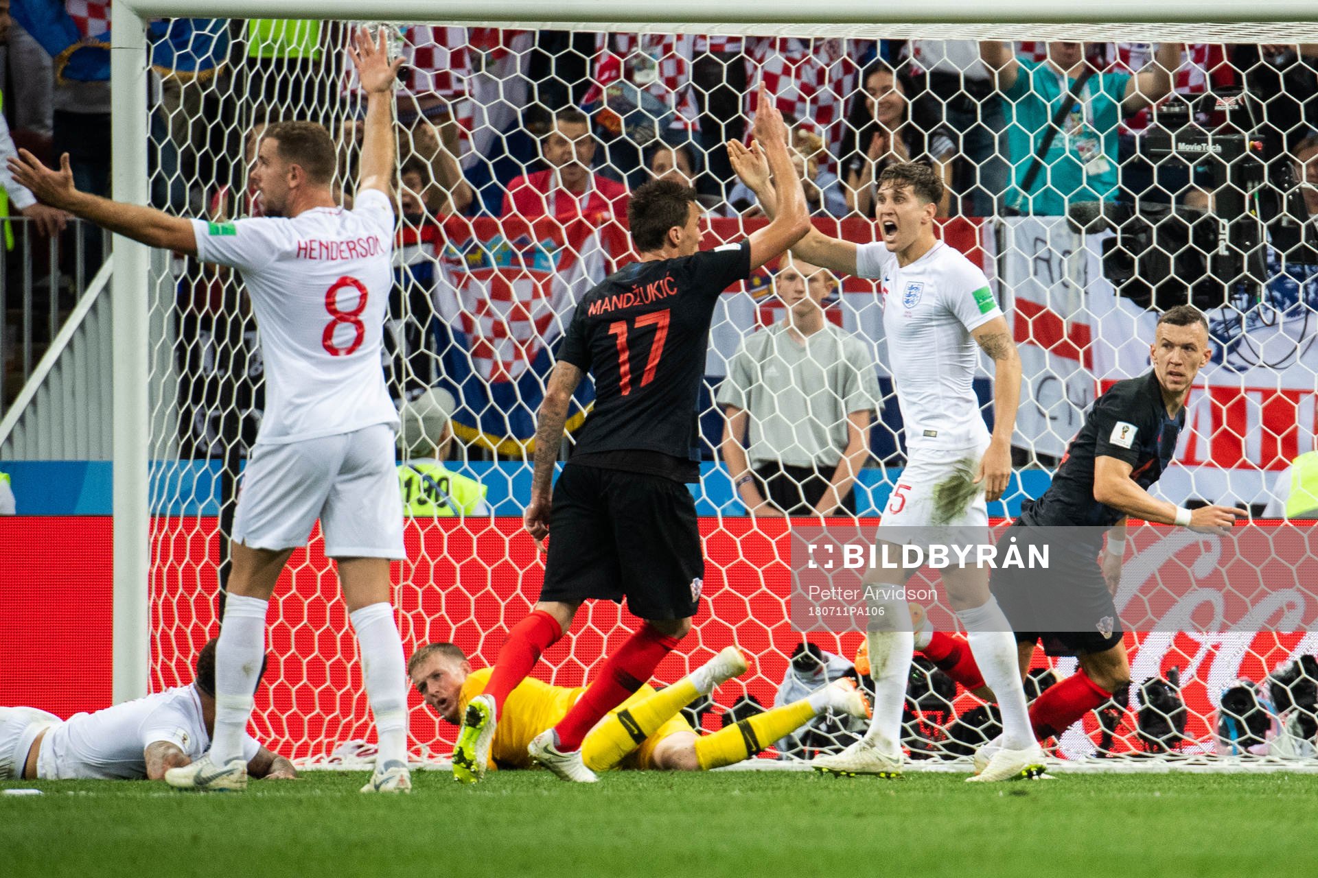 Jordan Henderson, John Stones and Harry Maguire react as