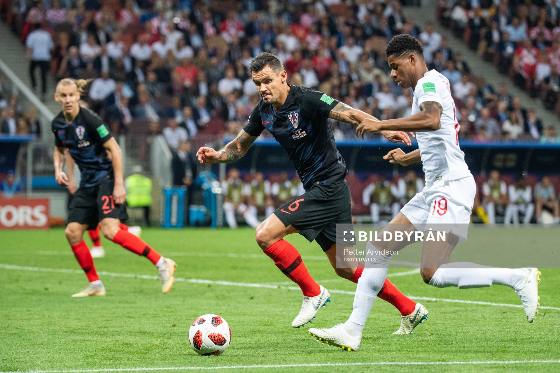 Dejan Lovren of Croatia defends against Marcus Rashford of