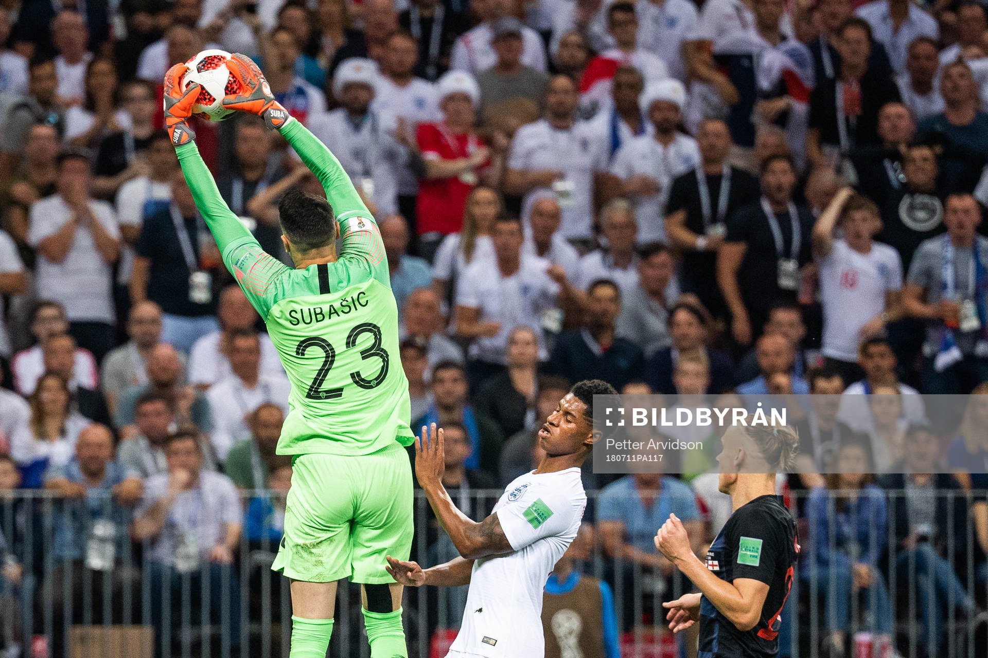 goalkeeper Danijel Subasic of Croatia takes the ball in