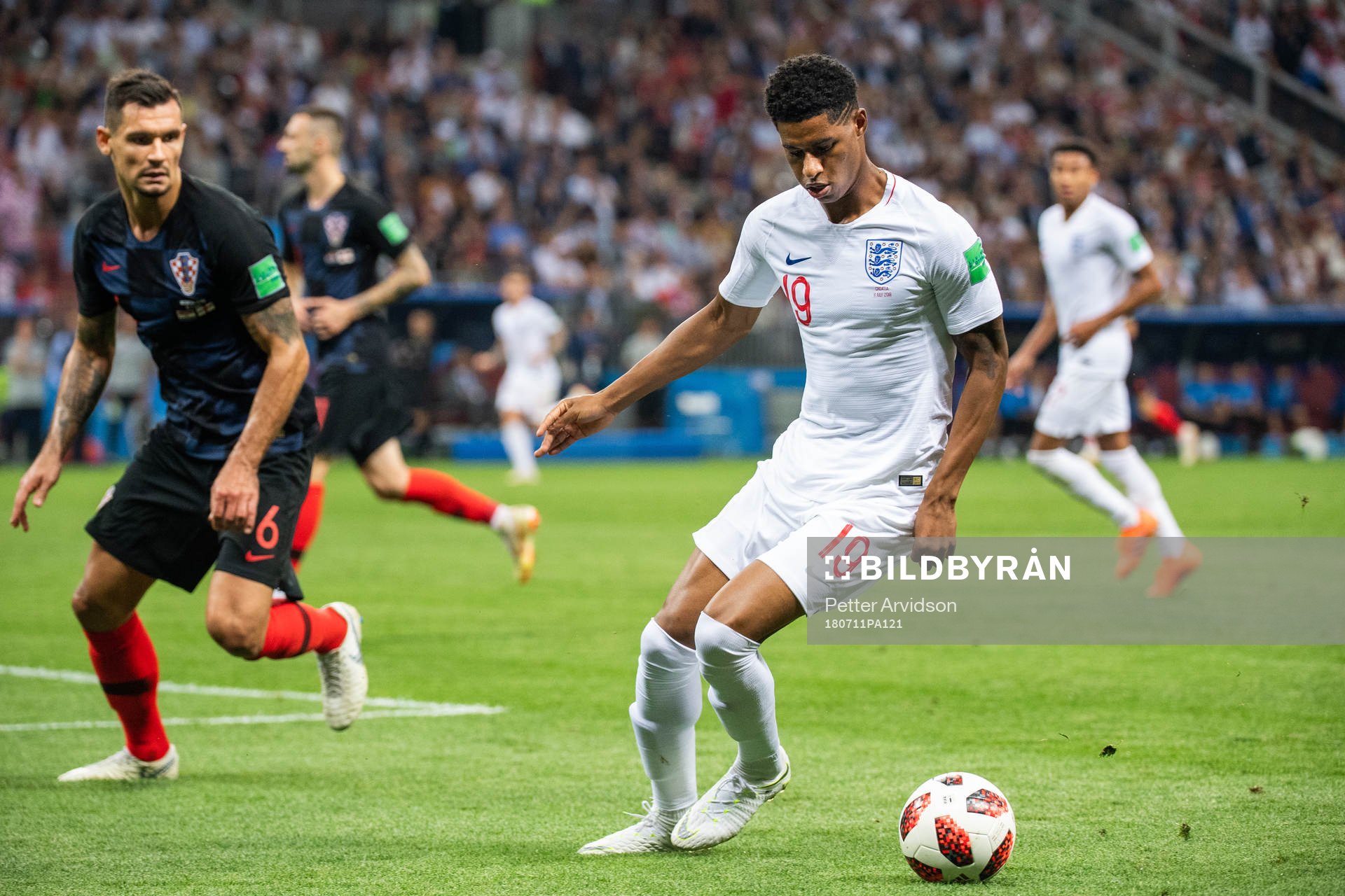 Marcus Rashford of England and Dejan Lovren of Croatia