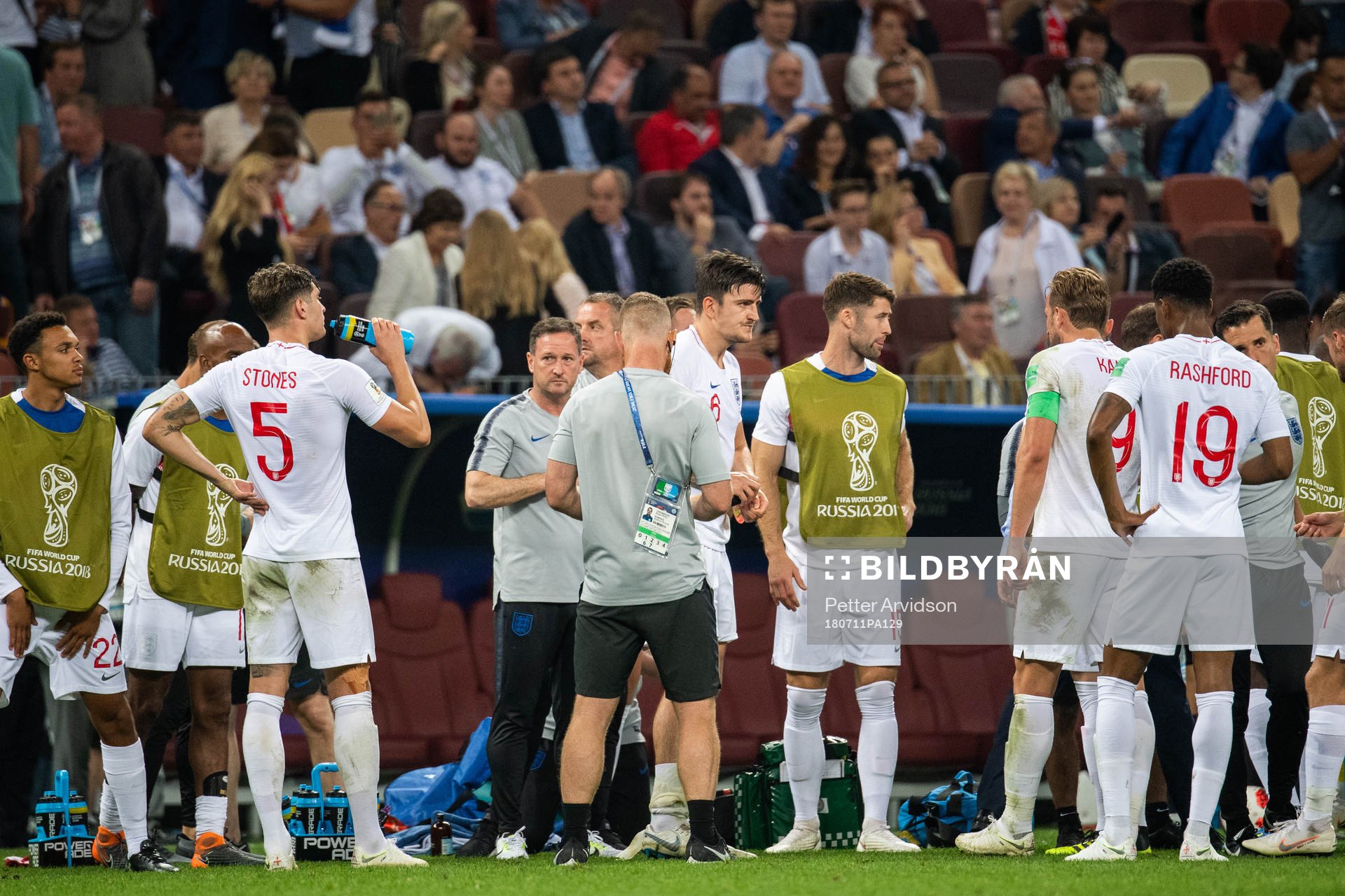 Players of England gather in wait for extra time