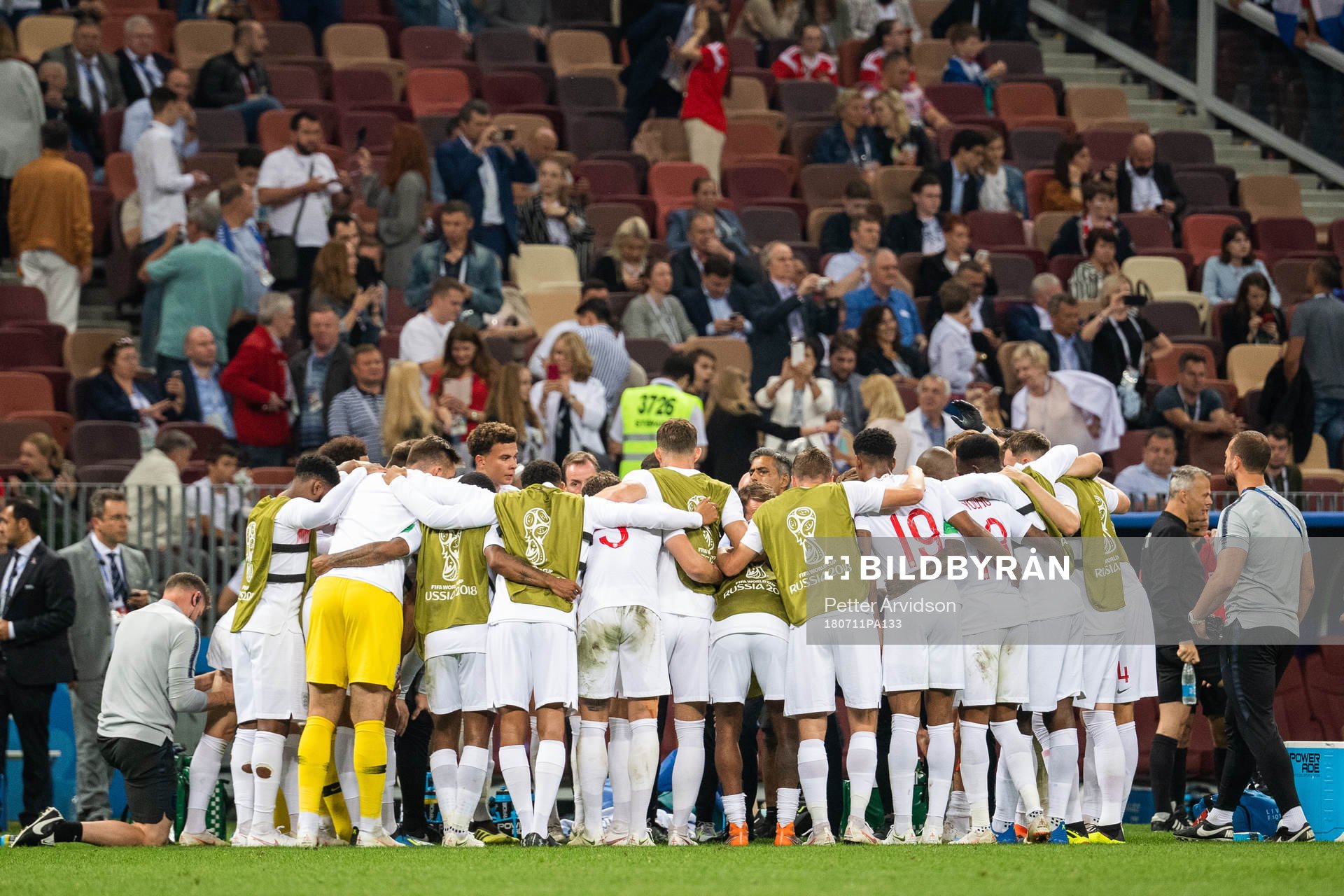 Players of England gather in wait for extra time