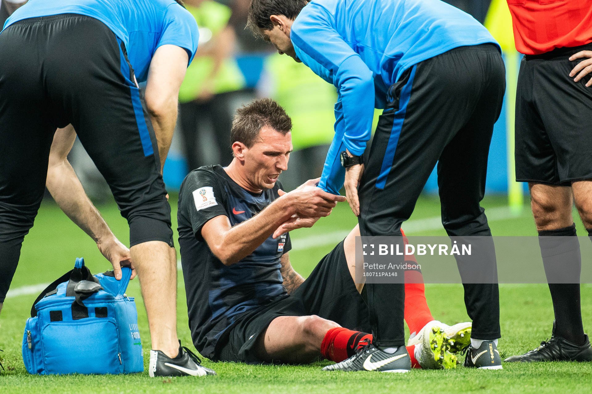 Mario Mandzukic sits getting medical attention