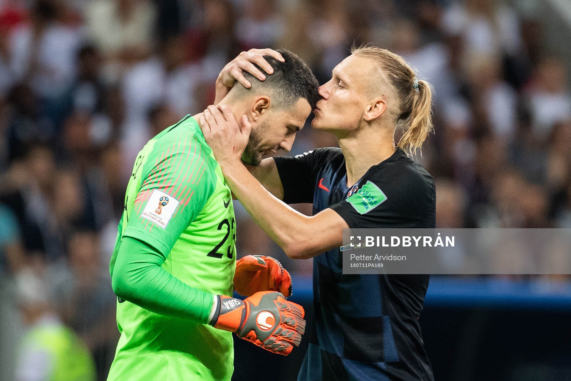 Domagoj Vida kisses goalkeeper Danijel Subasic of Croatia