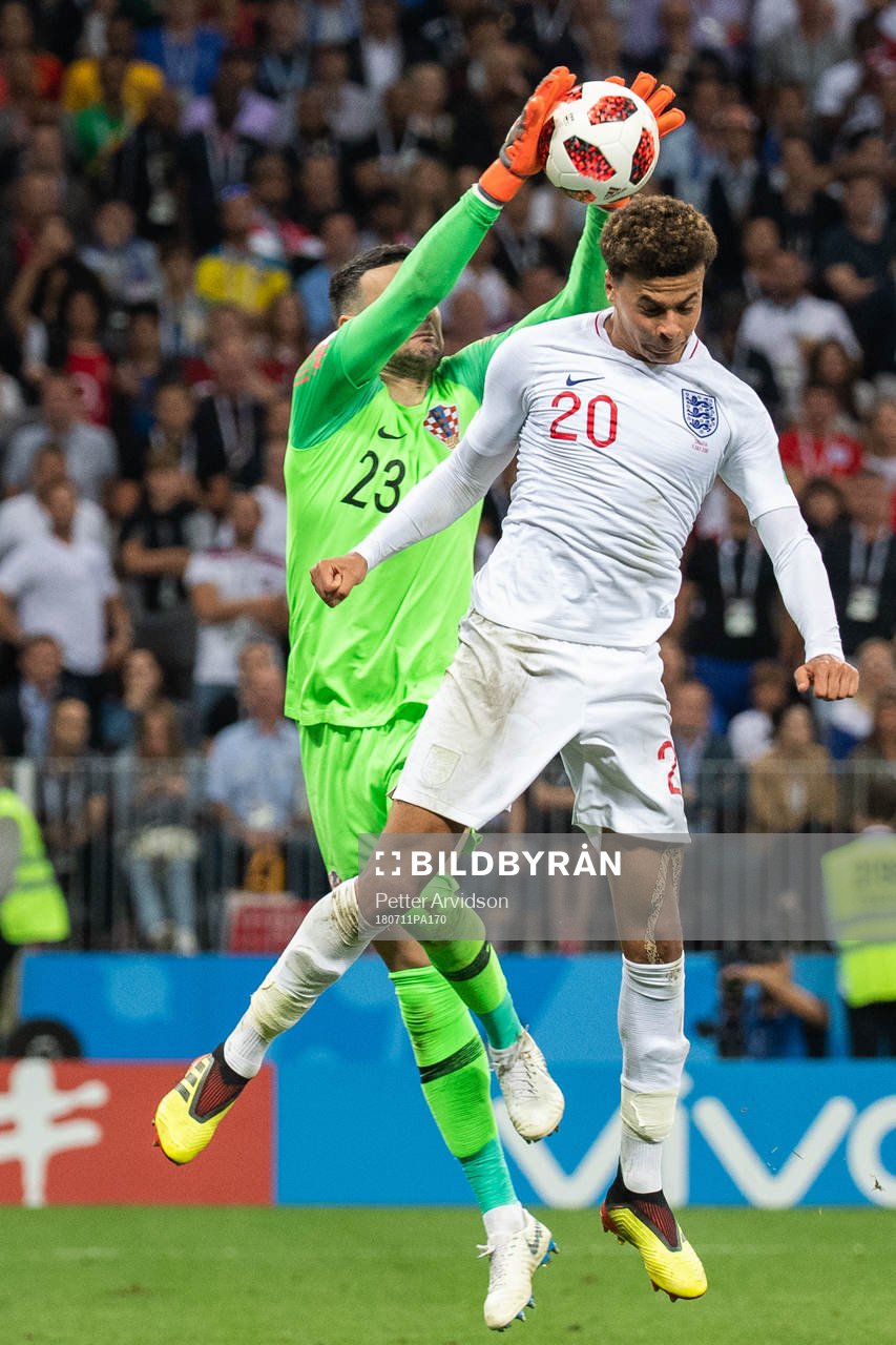 Dele Alli of England and goalkeeper Danijel Subasic of