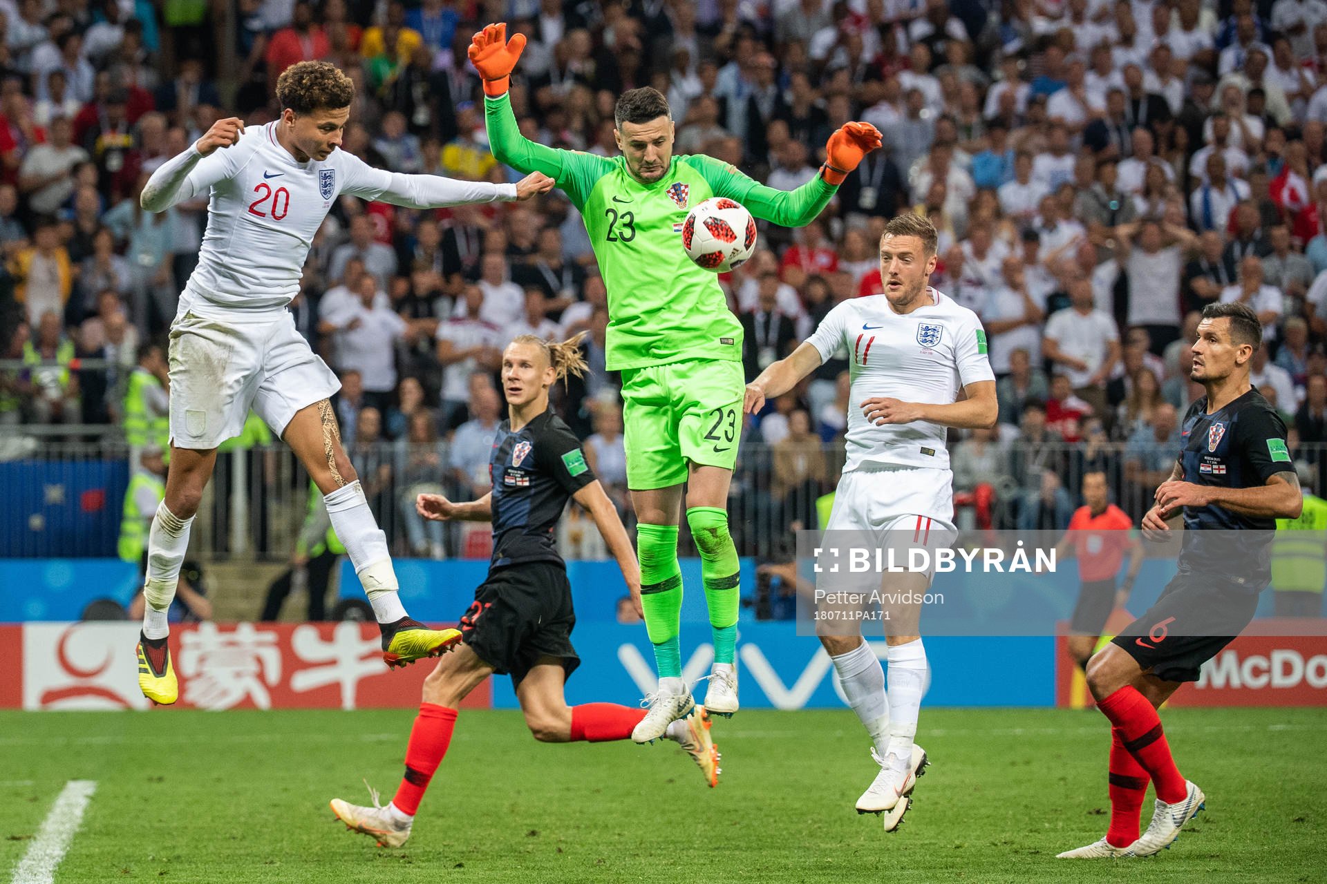 Dele Alli of England and goalkeeper Danijel Subasic of