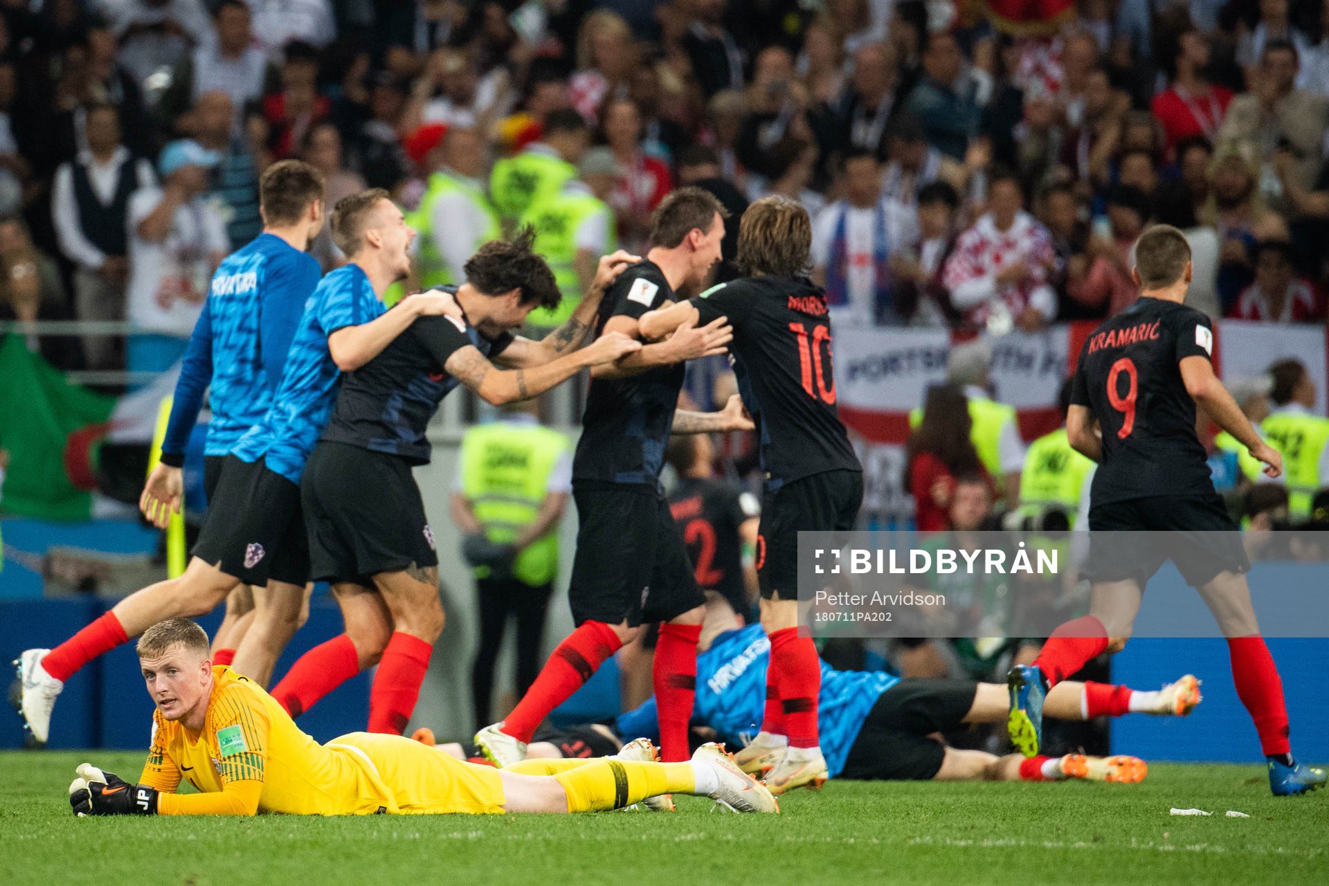 goalkeeper Jordan Pickford of England looks dejected while