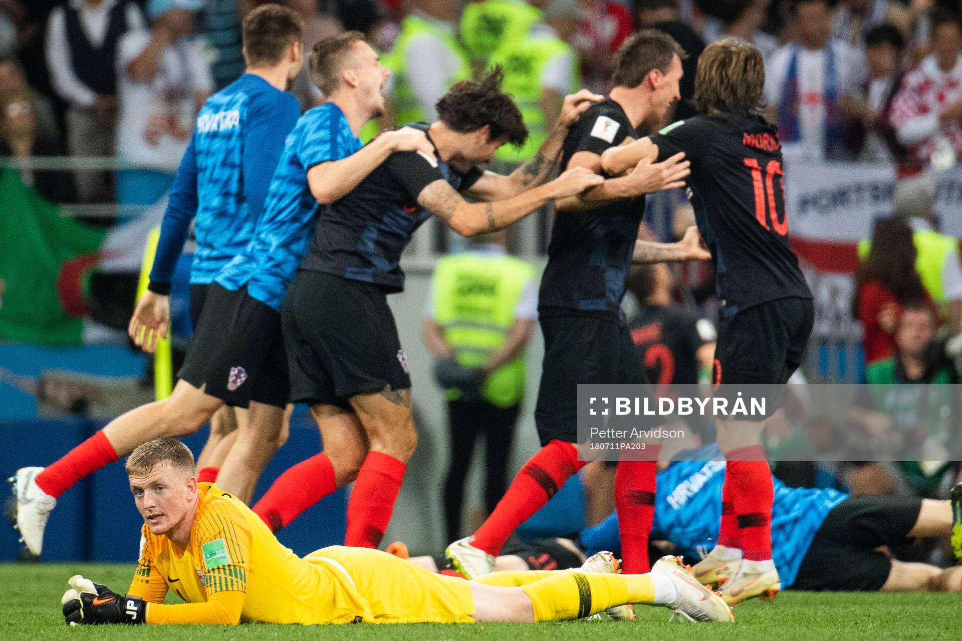 goalkeeper Jordan Pickford of England looks dejected while