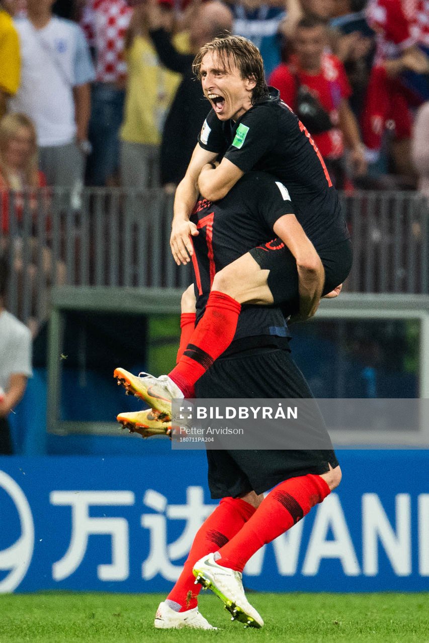 Luka Modric and Mario Mandzukic of Croatia celebrate after winning the FIFA World Cup semi final match between Croatia and England on July 11, 2018 in Moscow.