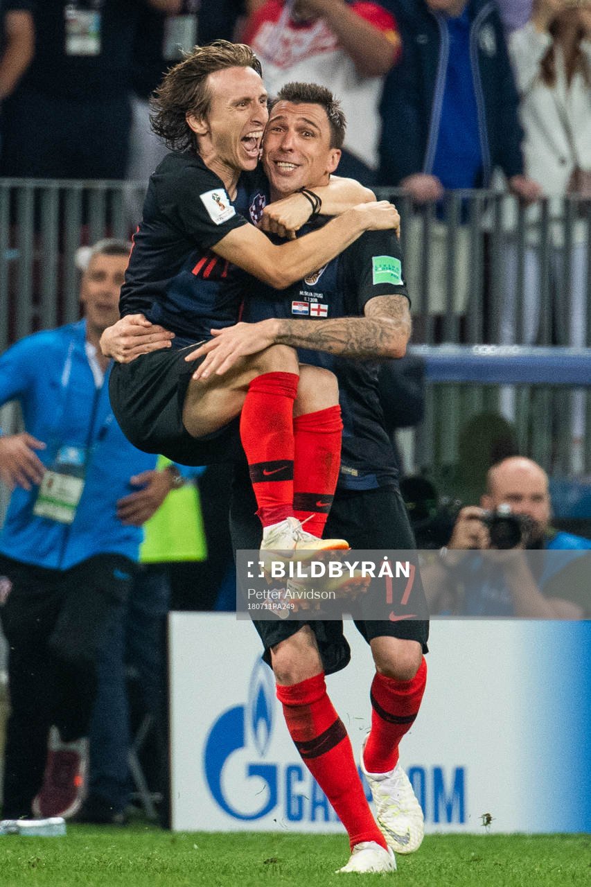 Luka Modric and Mario Mandzukic of Croatia celebrate after winning the FIFA World Cup semi final match between Croatia and England on July 11, 2018 in Moscow.