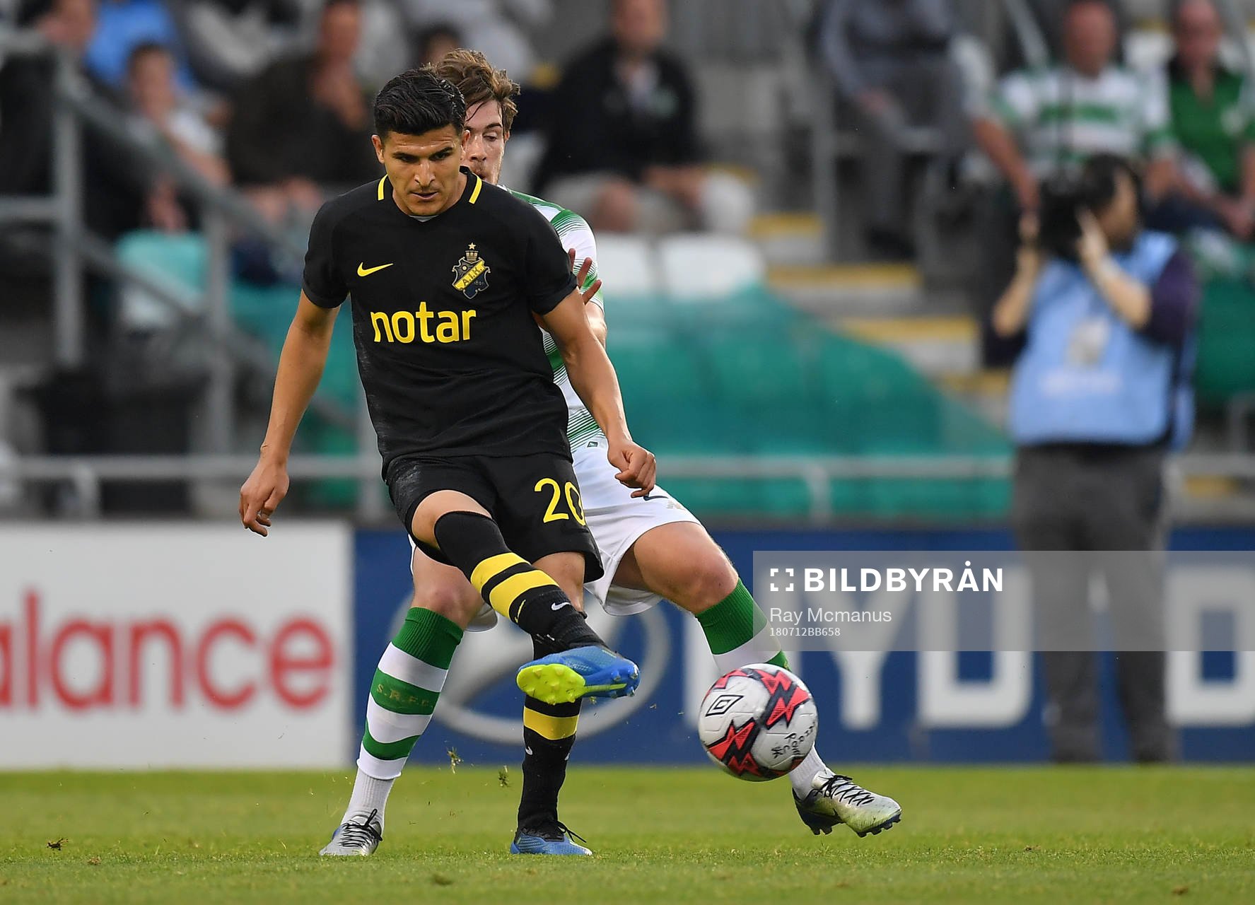 Tarik Elyounoussi of AIK in action against Sam Bone of
