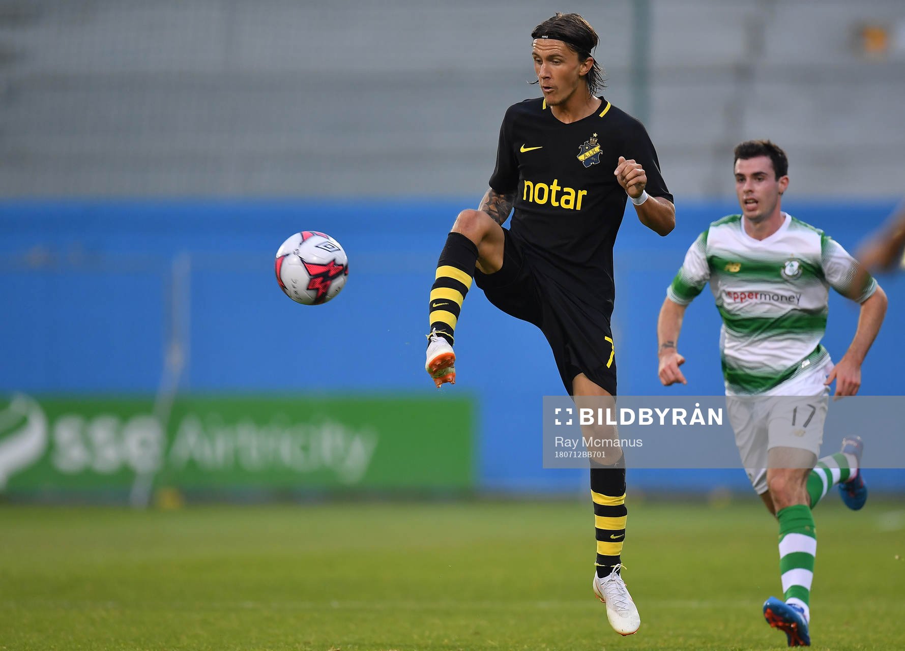 Kristoffer Olsson of AIK in action against Joel Coustrain