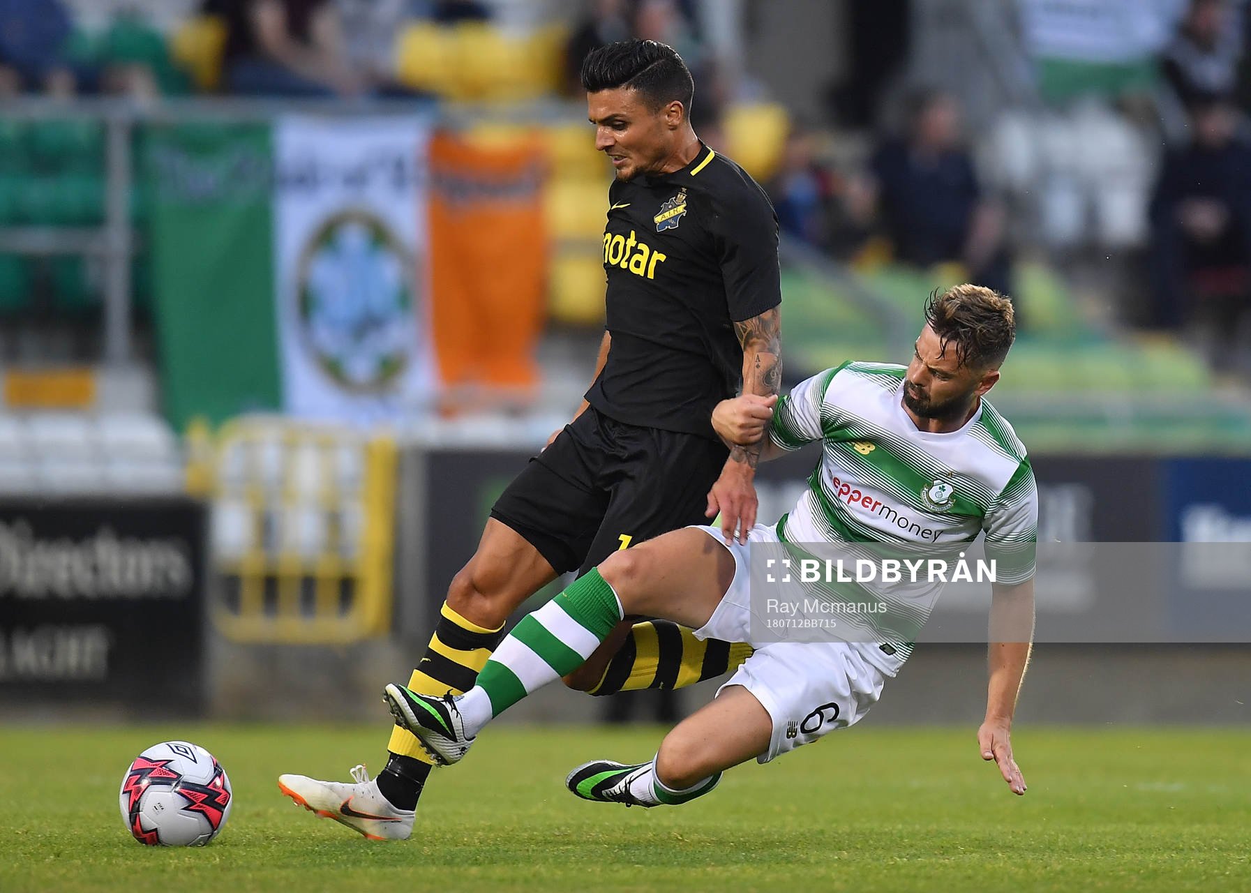 Ahmed Yasin of AIK is tackled by Greg Bolger of Shamrock