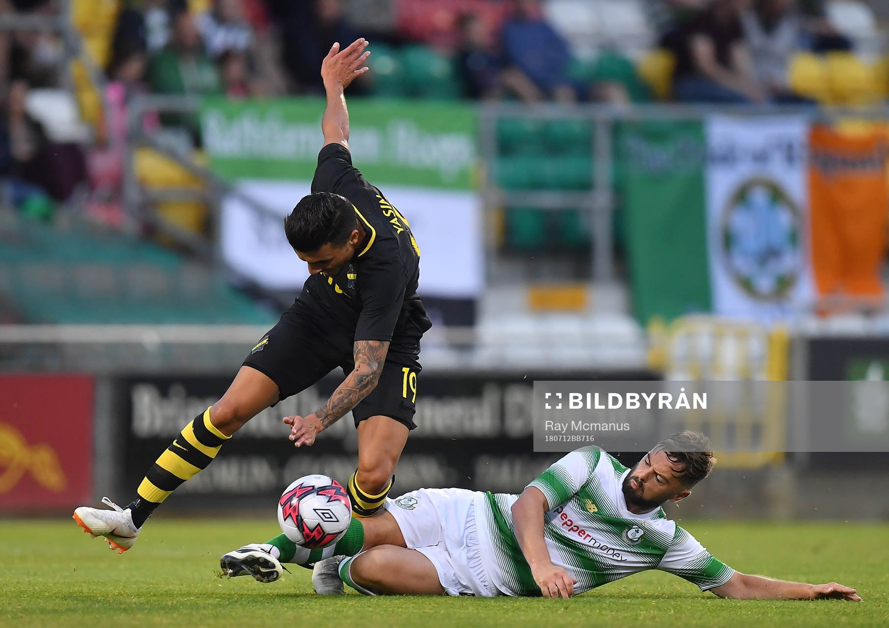 Ahmed Yasin of AIK is tackled by Greg Bolger of Shamrock