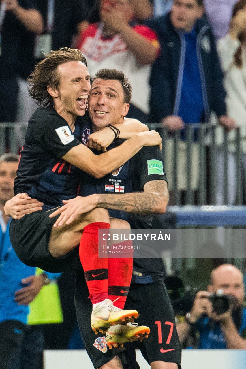 Luka Modric and Mario Mandzukic celebrates after the FIFA World Cup semi final match between Croatia and England on July 12, 2018 in Moscow.