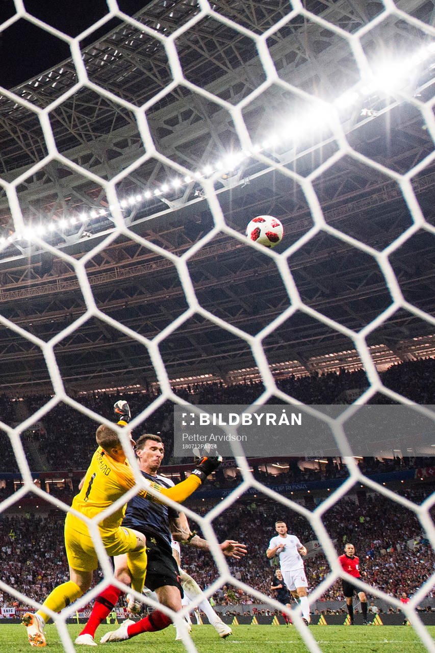 Mario Mandzukic of Croatia in action with goalkeeper Jordan