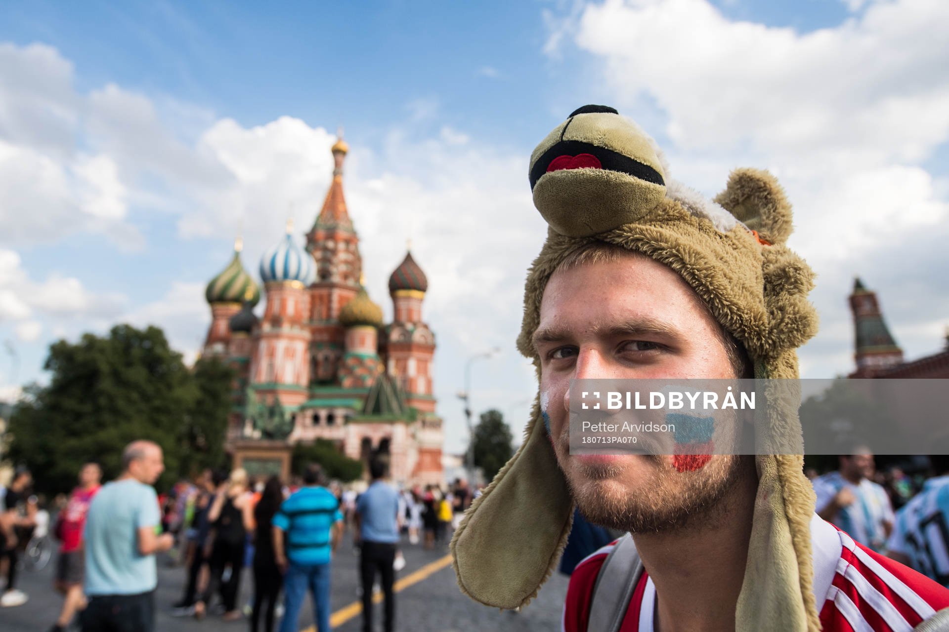 A fan of Russia in front of The Saint Basil's Cathedral at