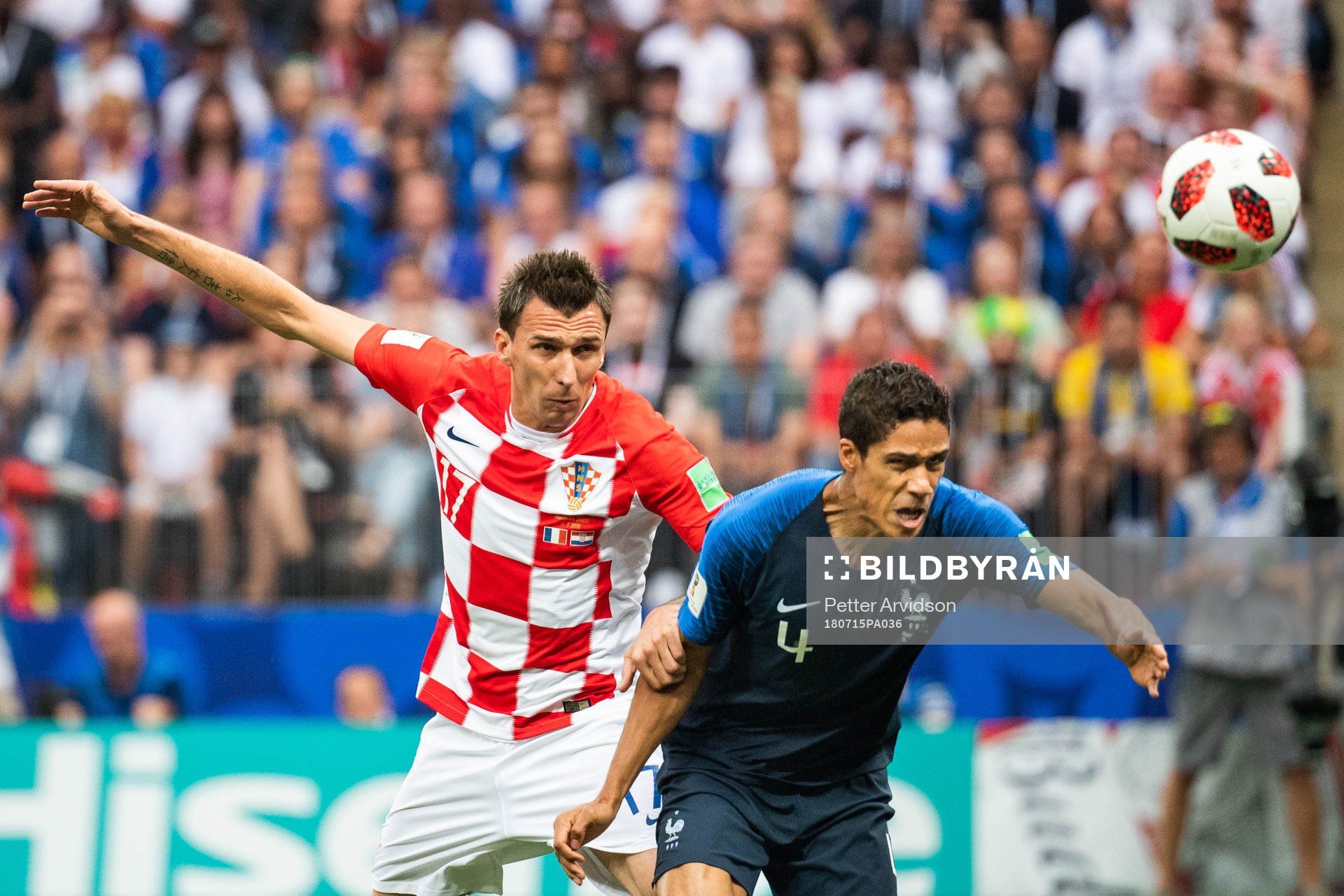 Mario Mandzukic of Croatia and Raphael Varane of France