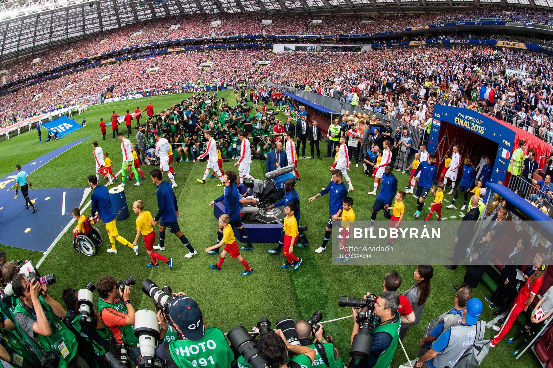 Players of France and of Croatia enter the pitch prior to