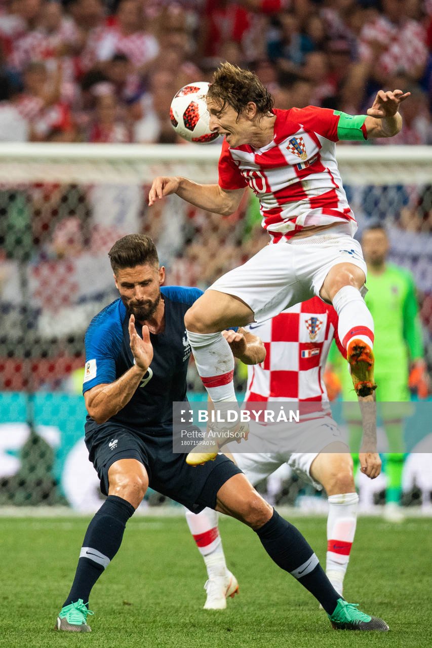 Olivier Giroud of France and Luka Modric of Croatia